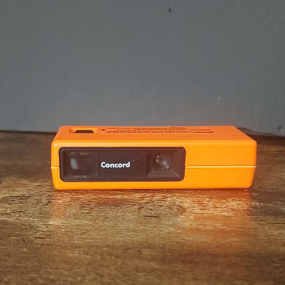Vintage 80s Concord Neon Orange Pocket Film Camera